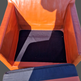 Pair of vintage orange leather armchairs