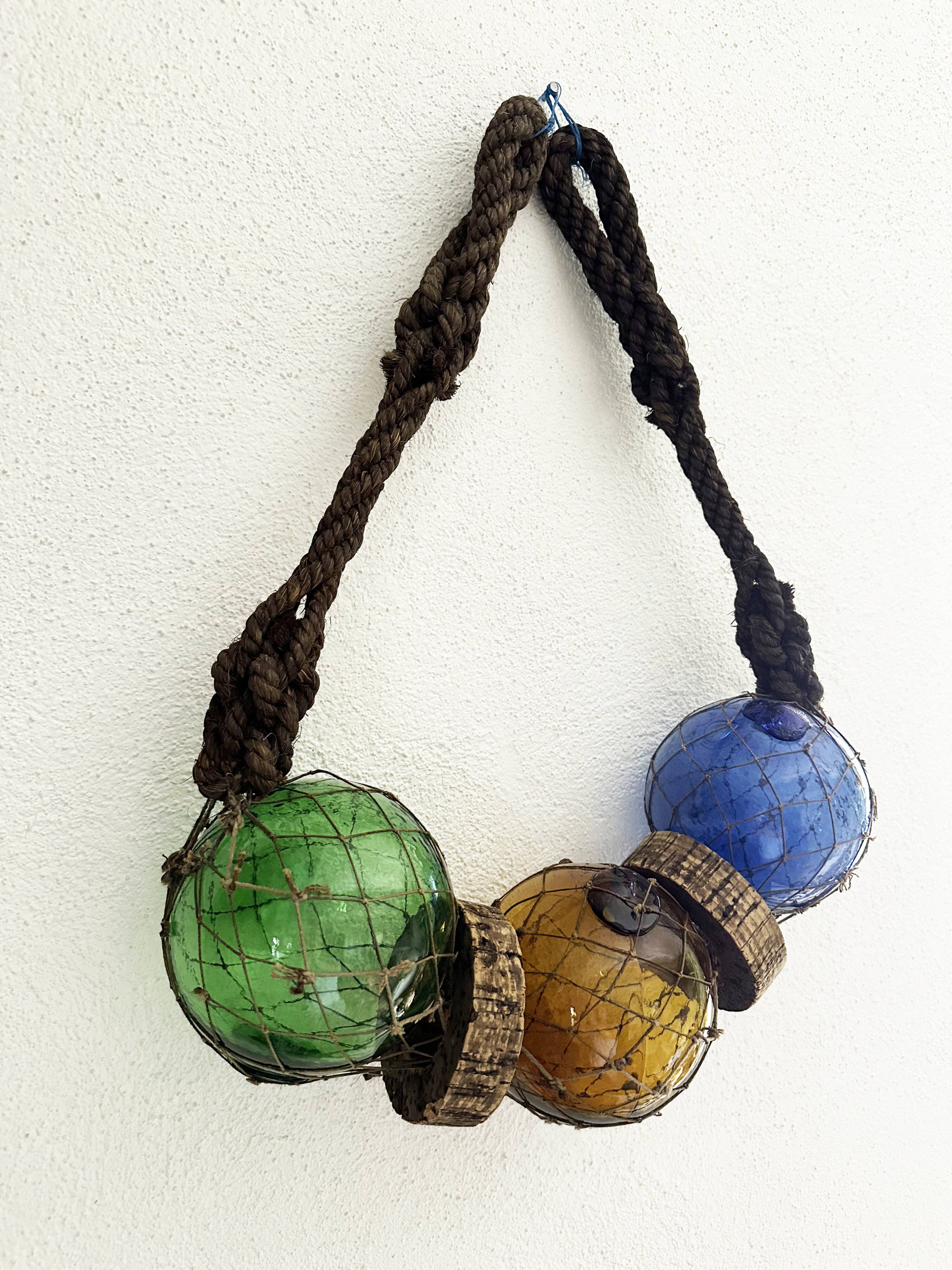 Fishing floats made of blown glass, cork, and rope. France, 1960s.