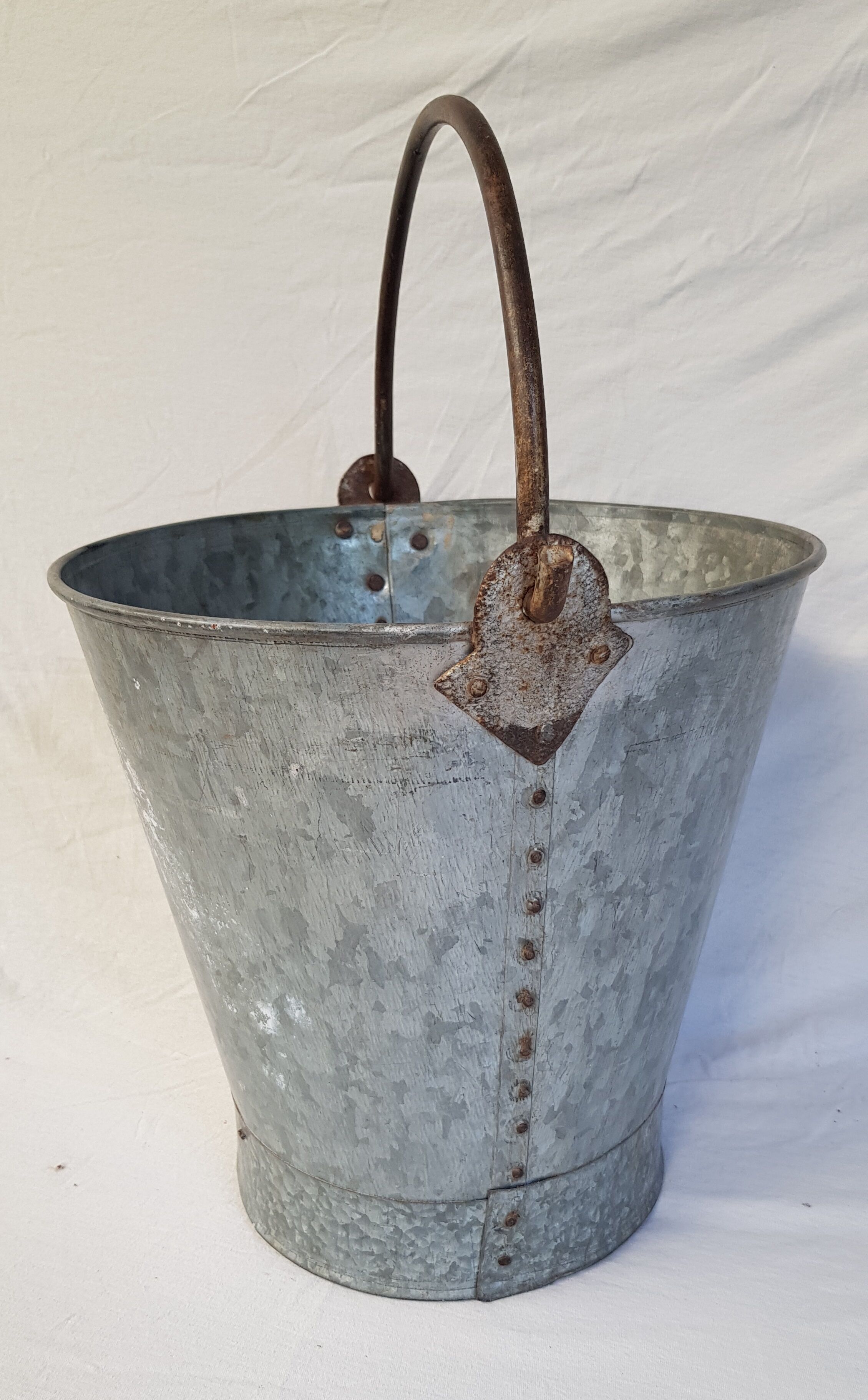 Old bucket with thick zinc handle