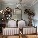 Pair of late 19th-century gilded wooden beds in Louis XVI style.