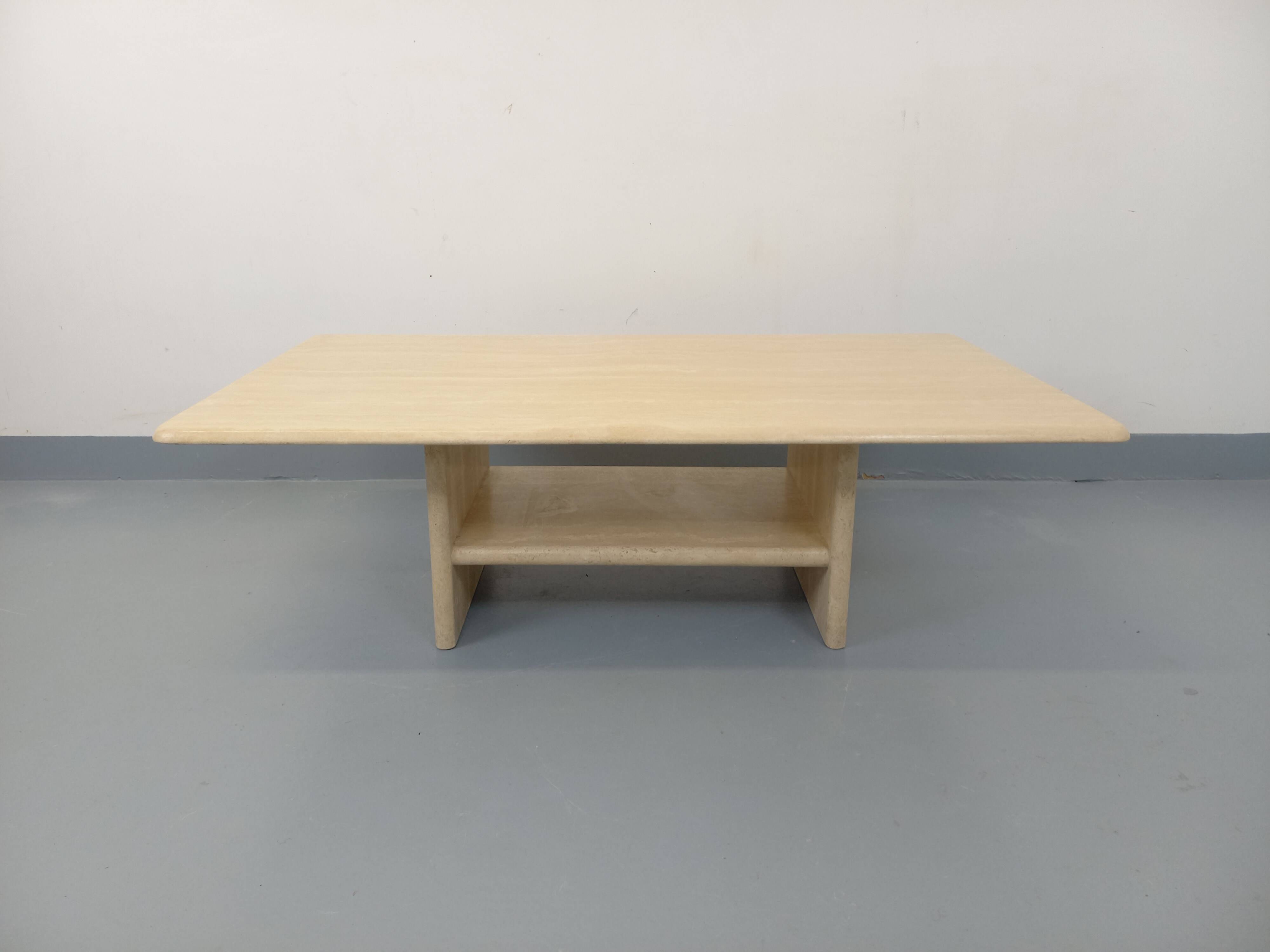 Vintage rectangular coffee table in travertine with magazine rack.