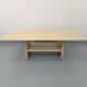 Vintage rectangular coffee table in travertine with magazine rack.