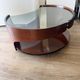 Italian Space Age coffee table in curved wood and smoked glass – 1970s