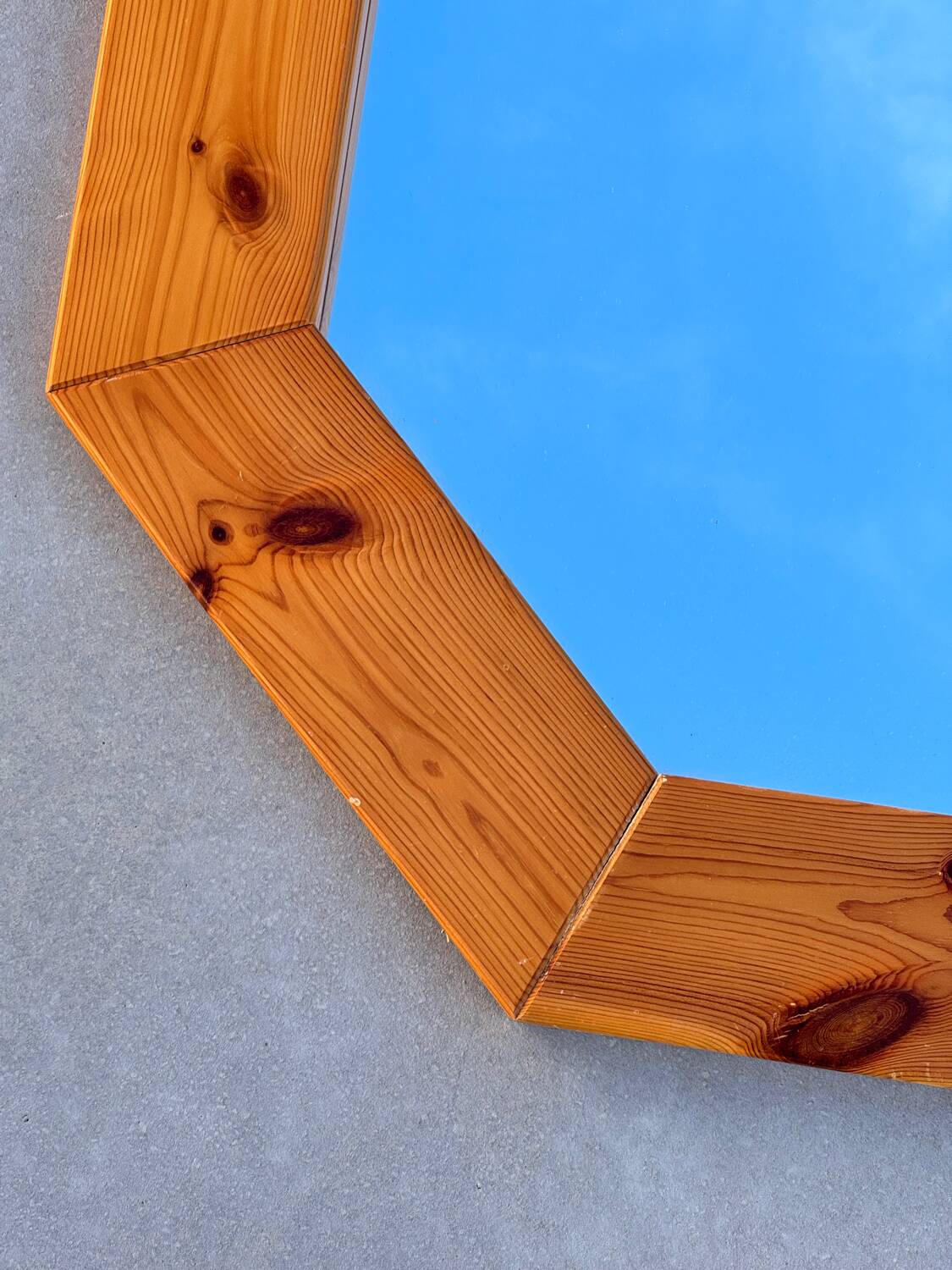 Octagonal pine mirror in 1980s Scandinavian design.