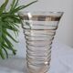 Vase with golden trim and lace-edged rim.