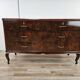 Chest of drawers with five drawers in wood and brass