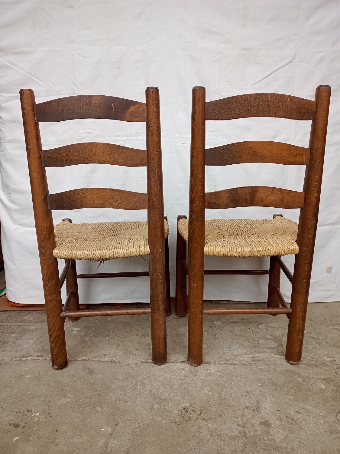 Brutalist chairs in walnut and straw