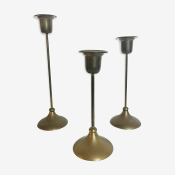 Trio of brass candlesticks