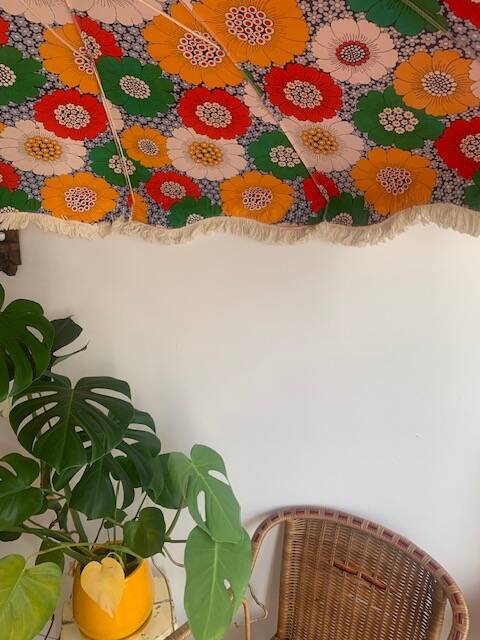 Large floral tilting beach umbrella with cotton fringes, 1960