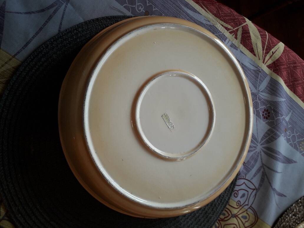 Glazed ceramic dessert plate with strawberry design.