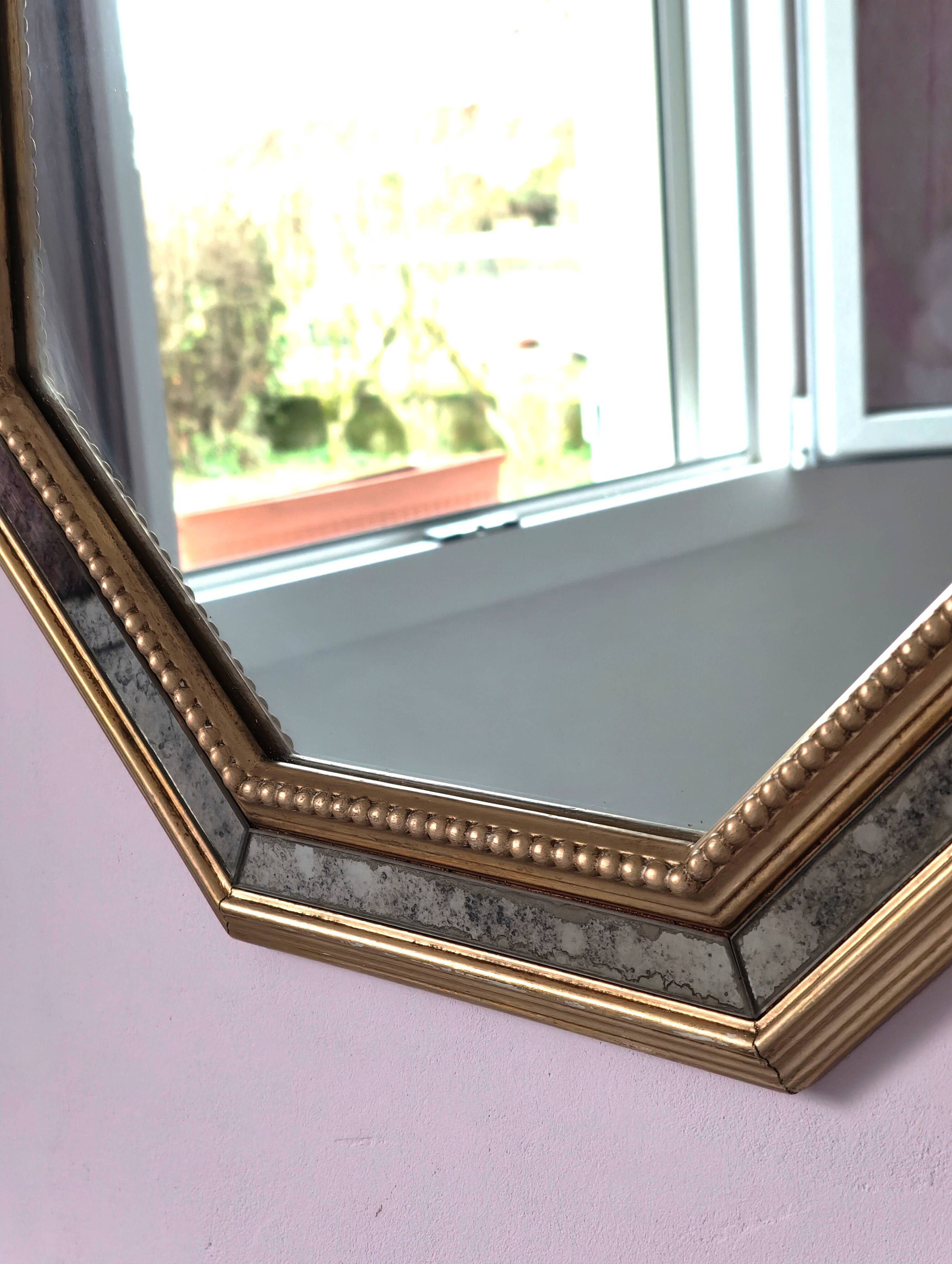 Antique mirror with gilded wooden frame.