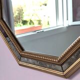 Antique mirror with gilded wooden frame.