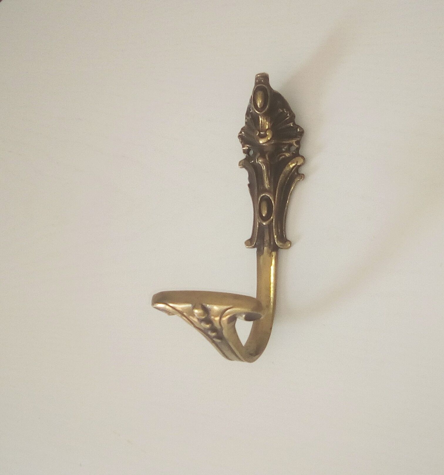 Old brass coat rack hook