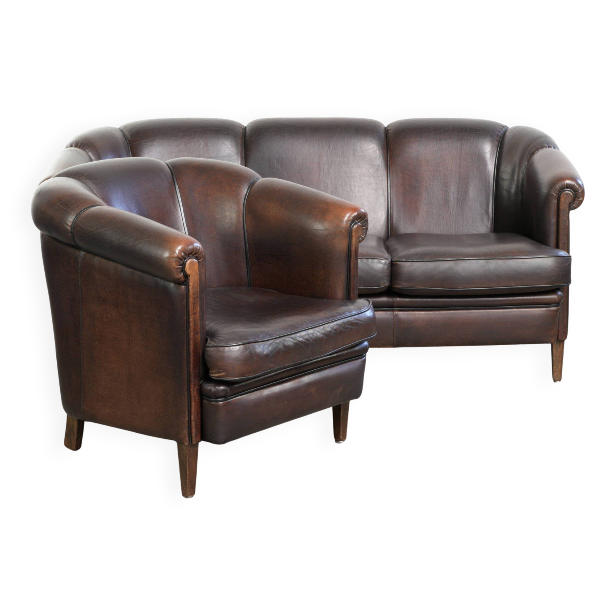 Set of a sheepskin sofa together with its matching club armchair