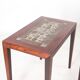 Set of coffee tables in rosewood and ceramic.