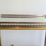 Neoclassical style rolling table in brass