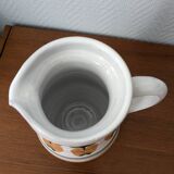 Ceramic pitcher with apple motif