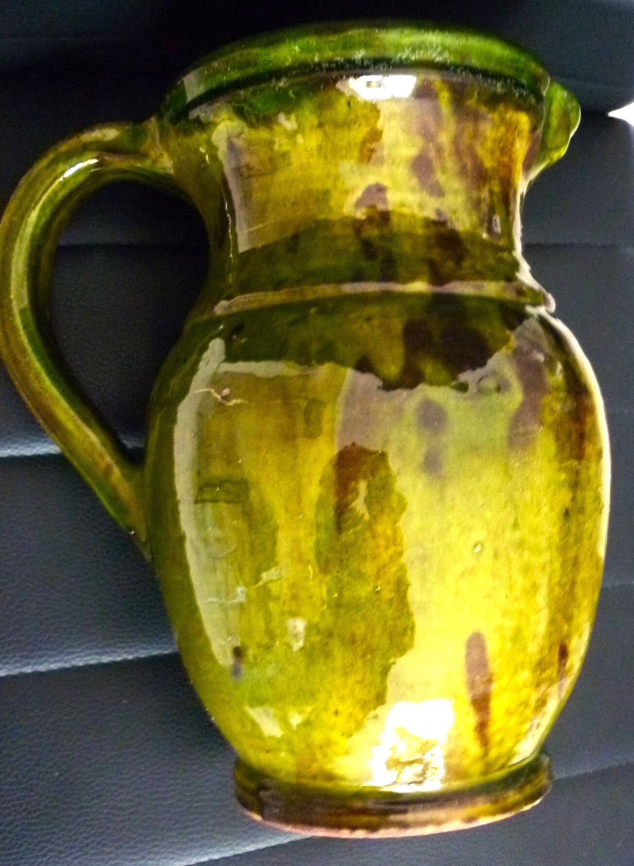 Pitcher vase, thick green glazed terracotta, signature to be identified