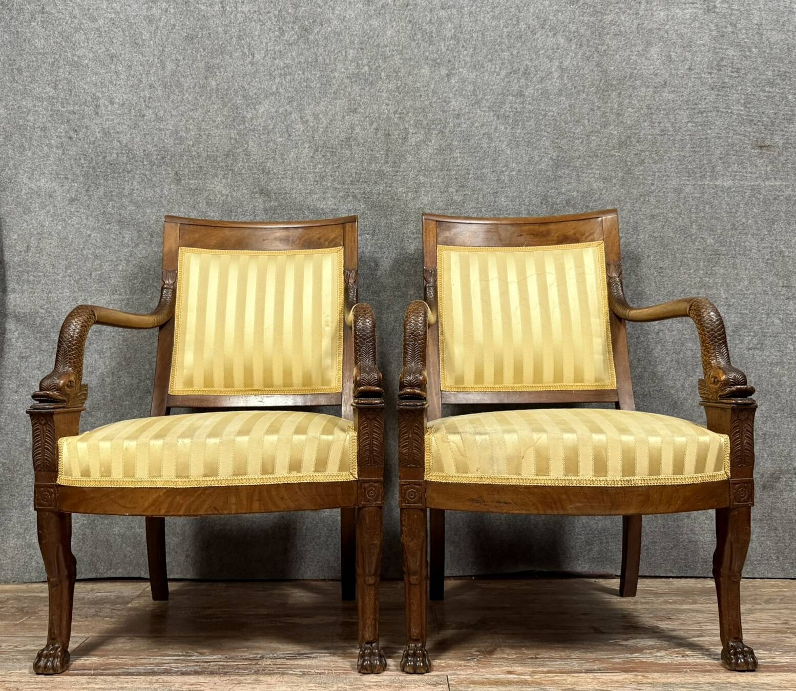 Pair of Empire period mahogany dolphin armchairs