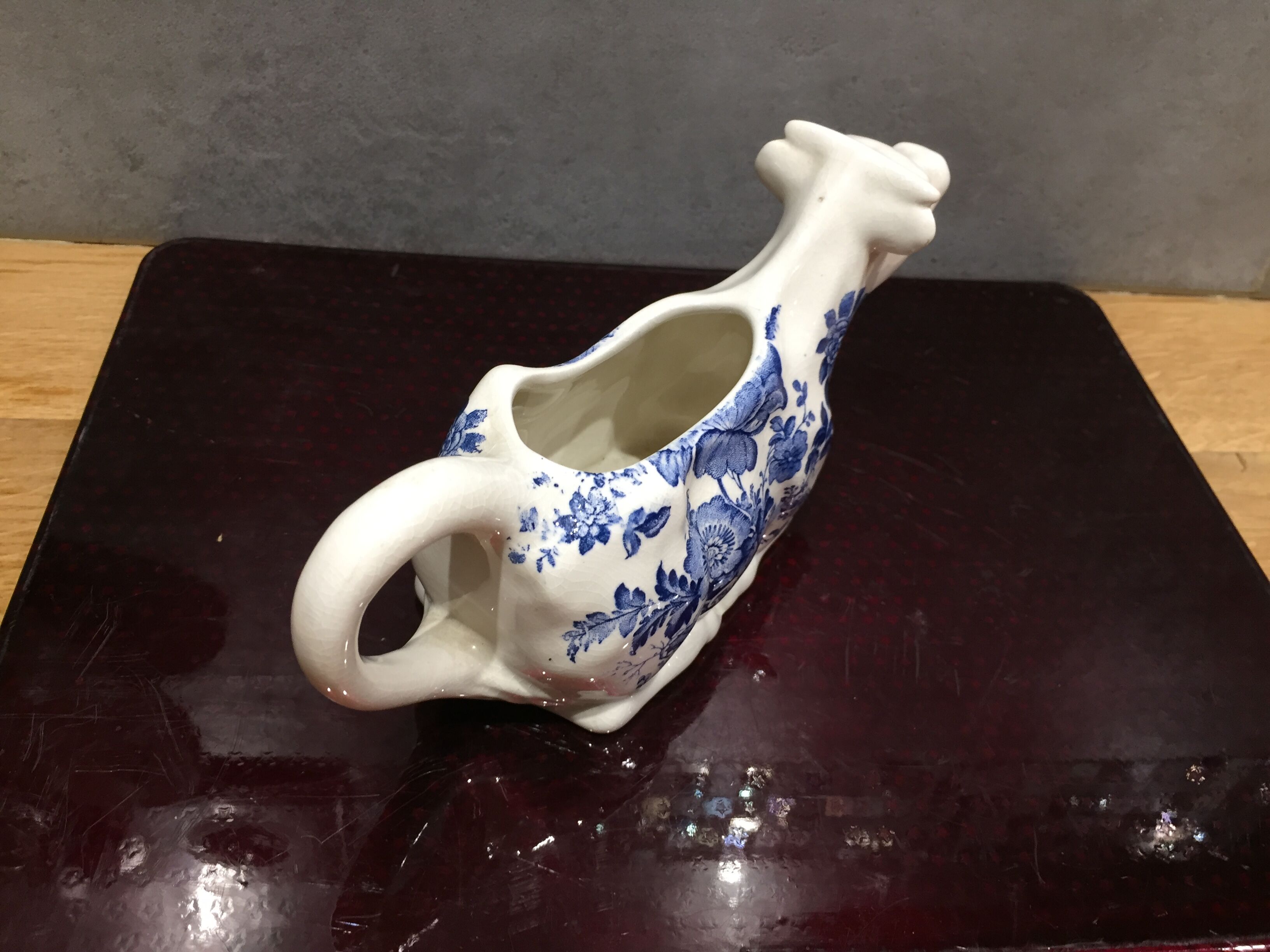 English porcelain cow-shaped sauce dish