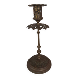 Old candlestick with chiseled bronze collar