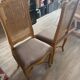 Four antique chairs in classic style with caning and upholstery.