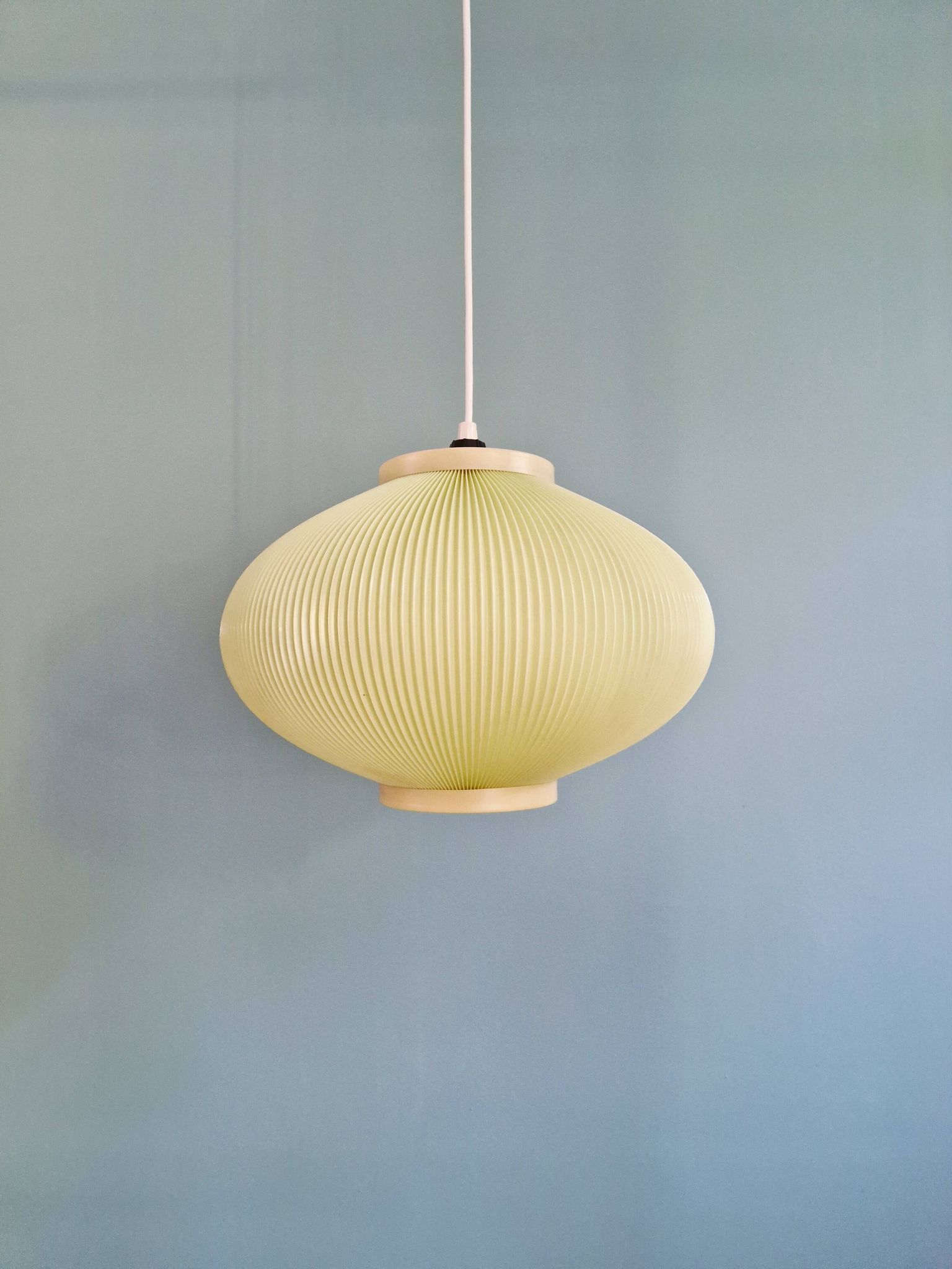 Vintage oval-shaped suspension in pleated celluloid, light green colour, 1960.