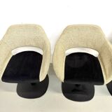 Series of six swivel chairs with an organic shell, patterned fabric and base.