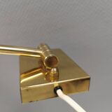 Danish Brass wall lamp with a ‘swivel’ effect.