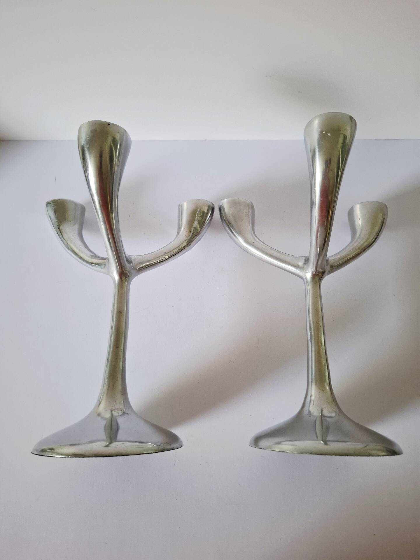 Vintage aluminium candlestick duo