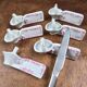 Set of 6 vintage porcelain knife rests with name markers, basket shape.