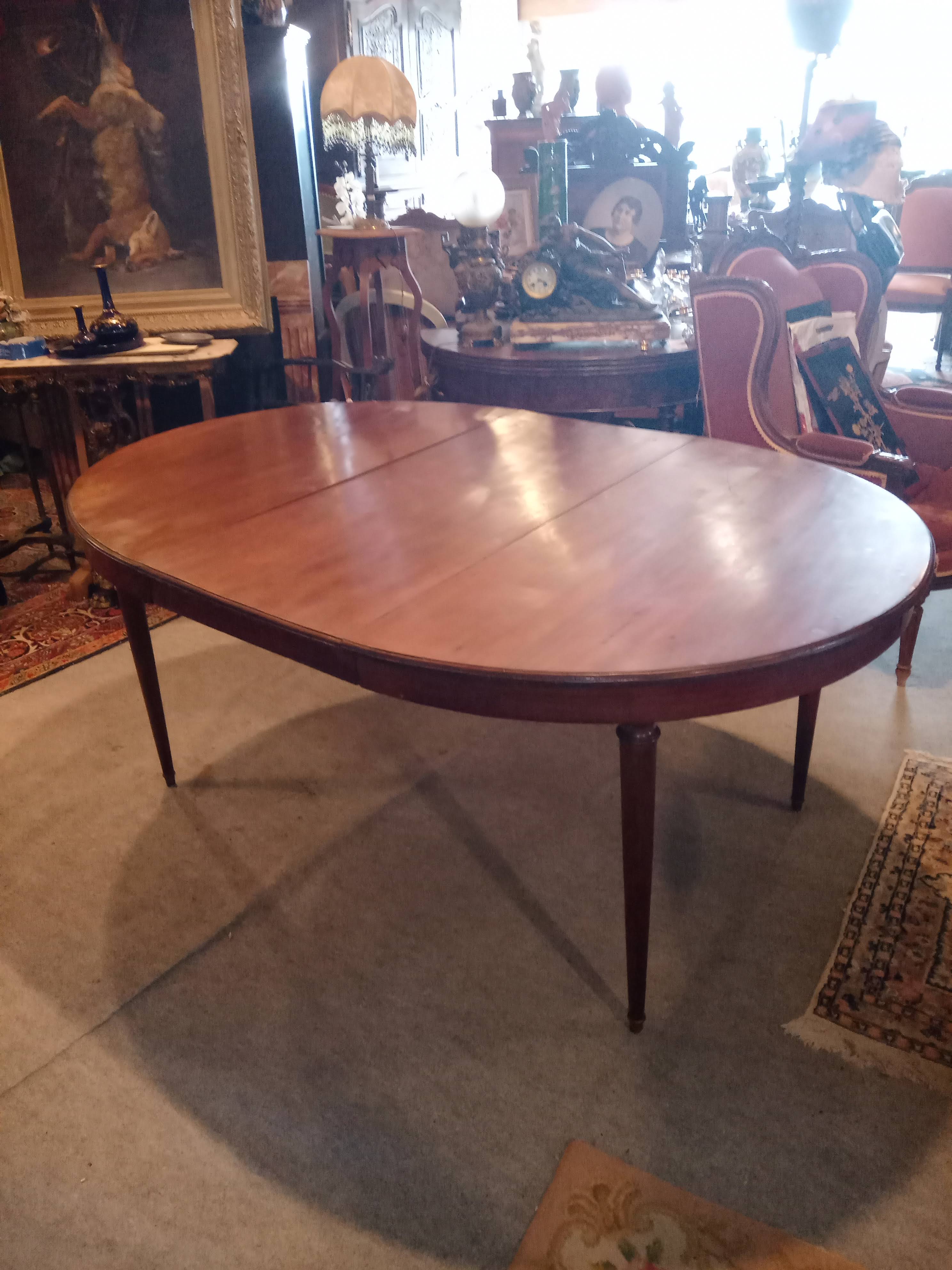 Oval mahogany table with extension cords