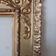Miroir ancien en bois doré