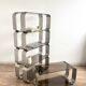 Stainless steel and smoked glass shelves by Donald Singer