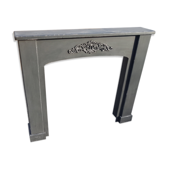 Wooden fireplace and patinated plywood