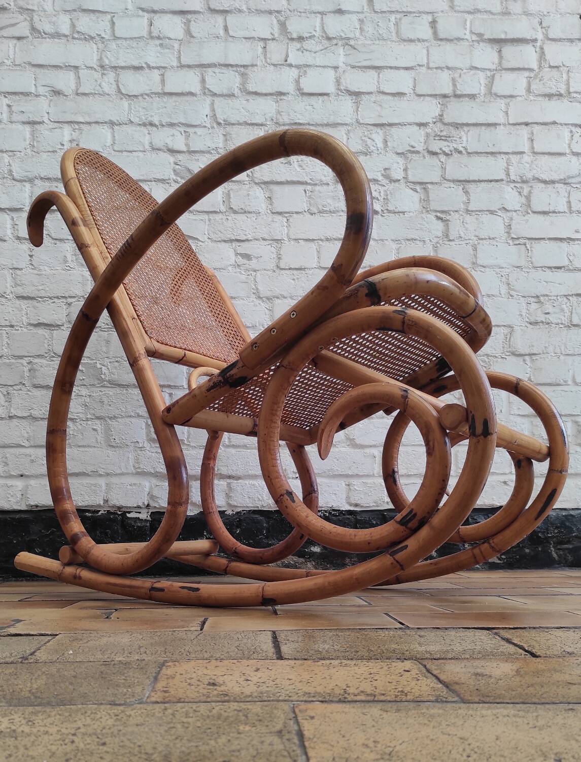 Vintage rocking chair in rattan and cane.