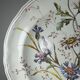 Antique Longchamp shallow dish with polychrome daisies in ironstone.