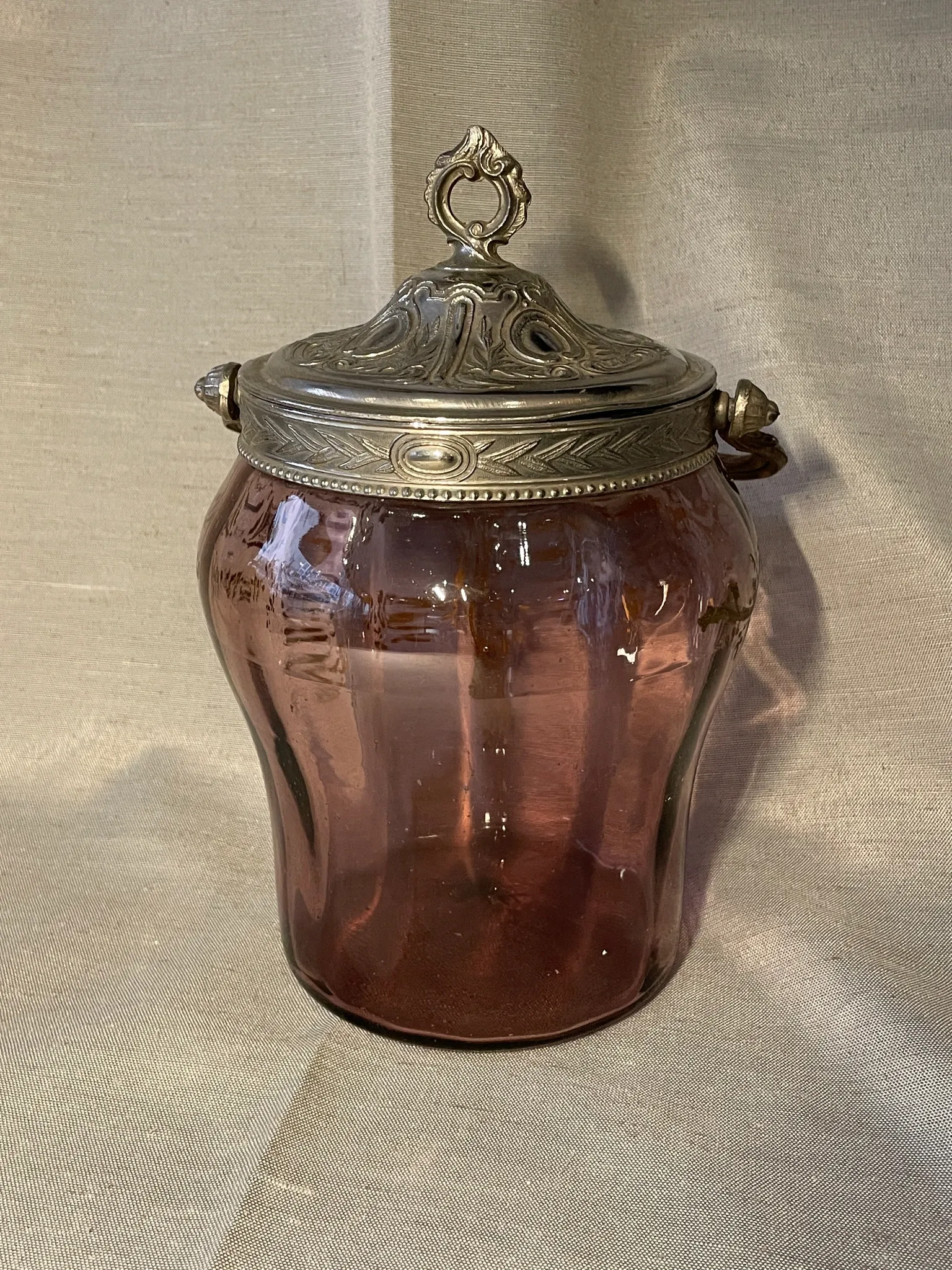 Purple glass biscuit barrel with painted gold arabesque decorations for cakes.
