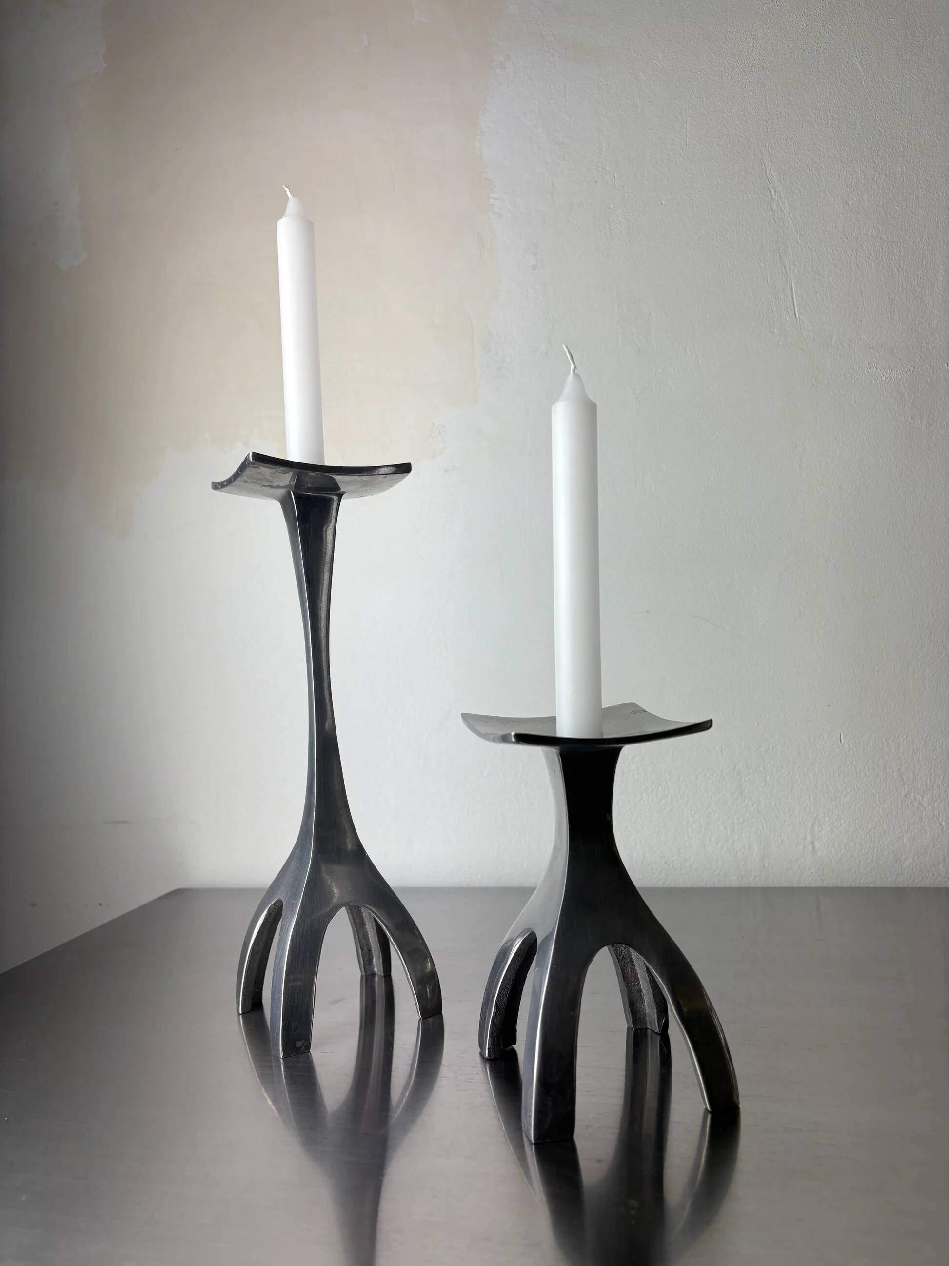 Pair of biomorphic candleholders, solid aluminium, Spain, 1970s