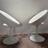 Pair of vintage white swivel armchairs in tulip style.