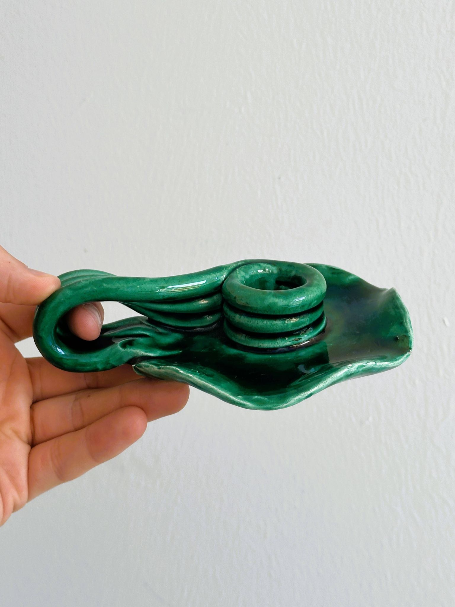 Vintage green glazed ceramic candle holder, organic design.