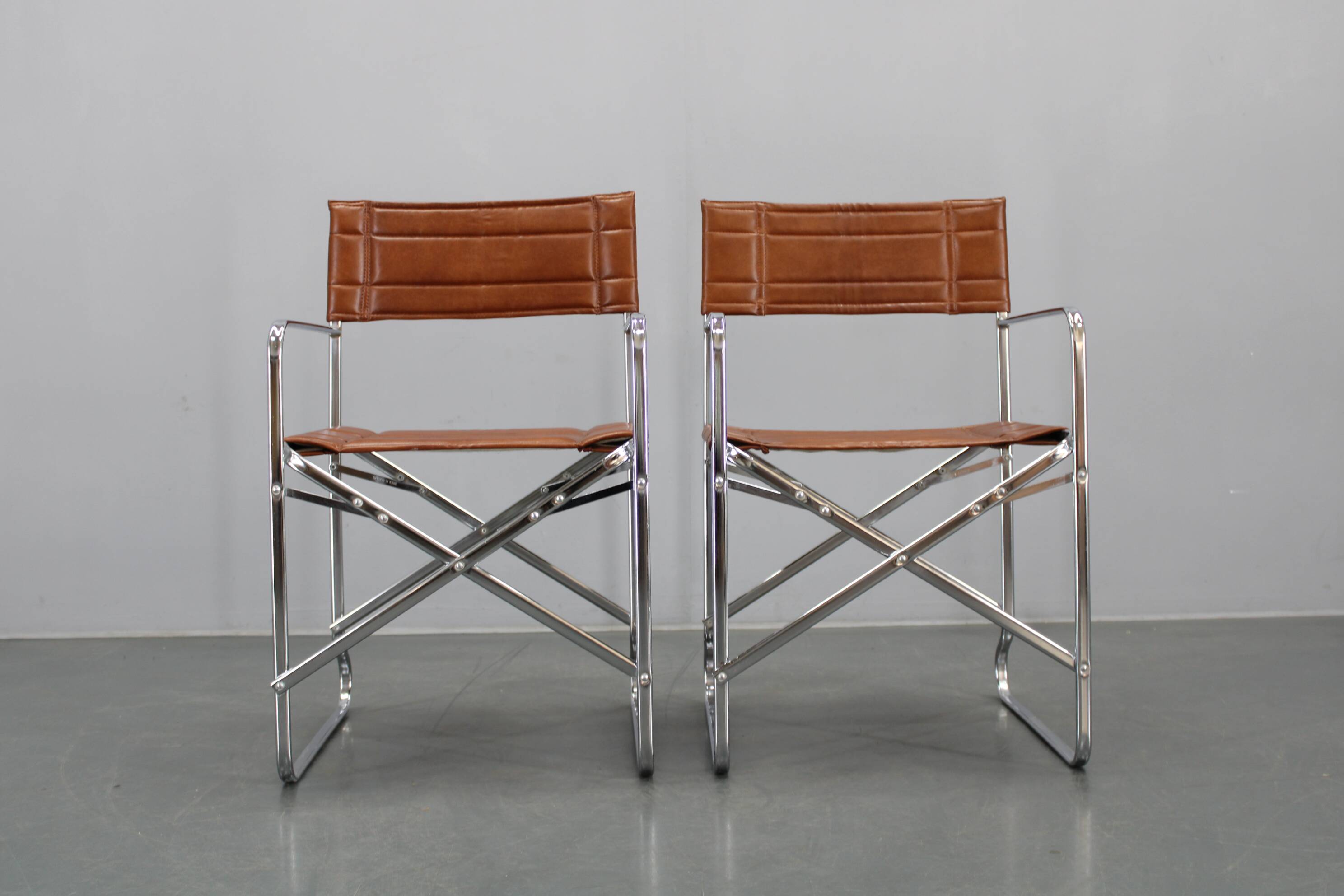 1970s pair of Italian folding chairs with leatherette upholstery