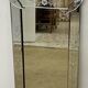 Venetian mirror with floral decoration pediment