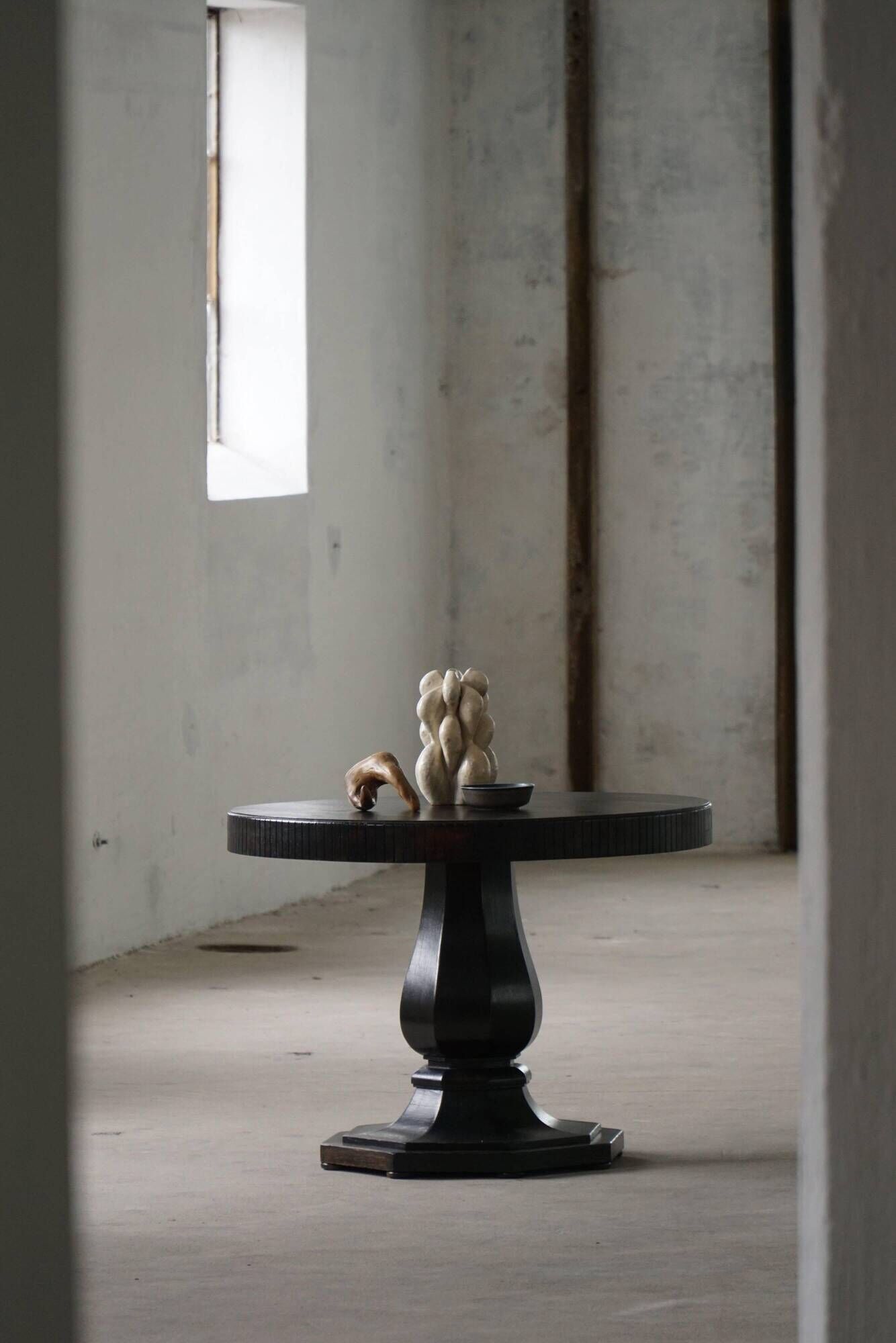 Dining table / round console in Danish Art Deco style in blackened oak, early 20th century.