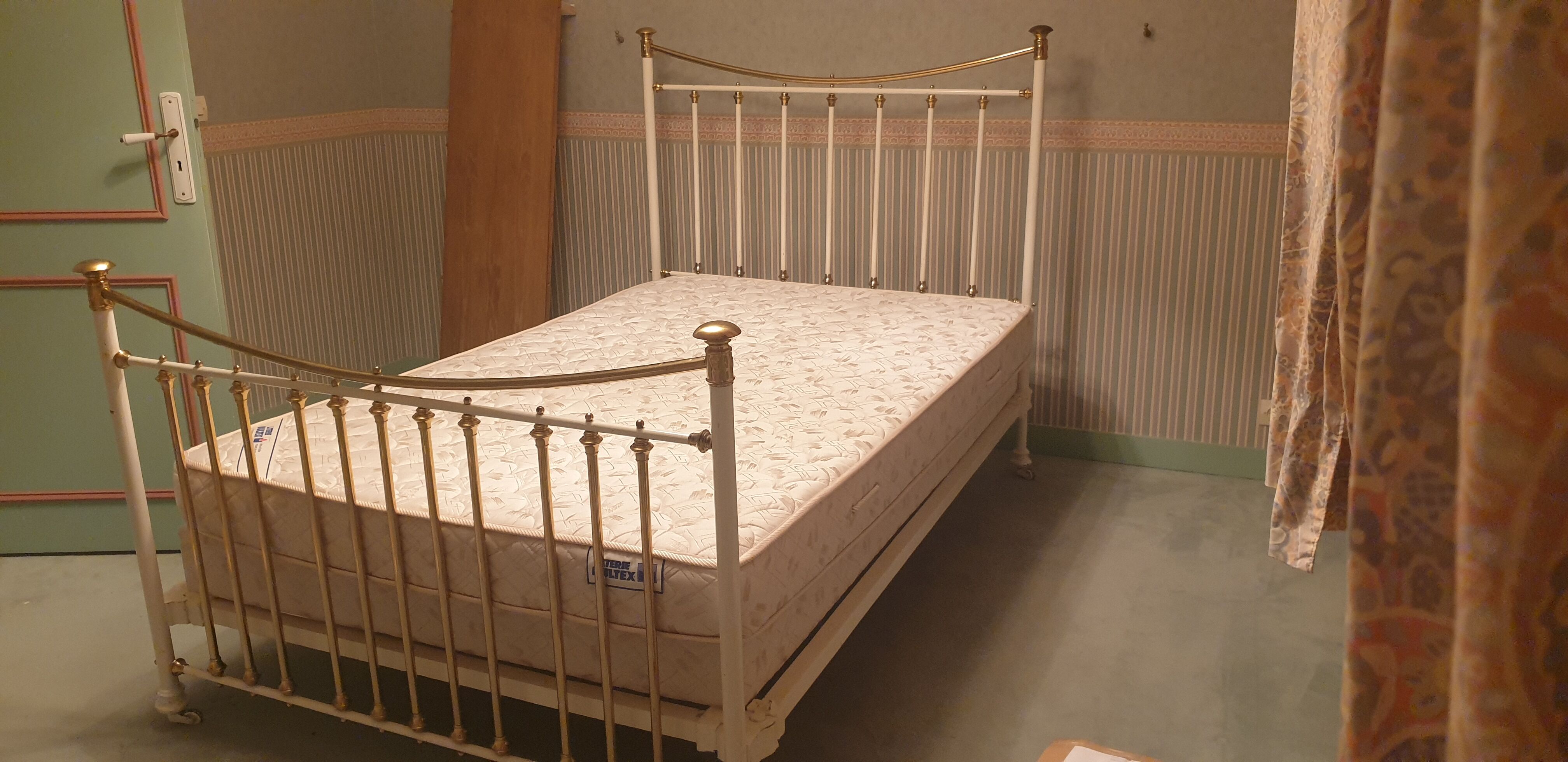 Restored old iron bed