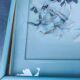 Two vintage paintings made with feathers, hummingbird motif