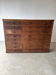 Large wooden workshop cabinet with 16 drawers, antique from the early 1900s.