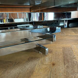 70s design coffee table in rectangular glass with chrome legs.