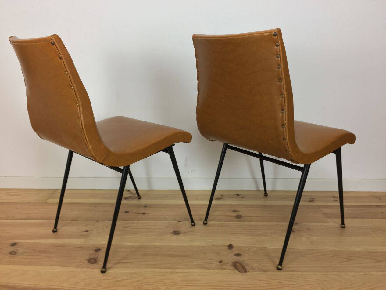 Pair of 1950s chairs with compass legs and brown faux leather.