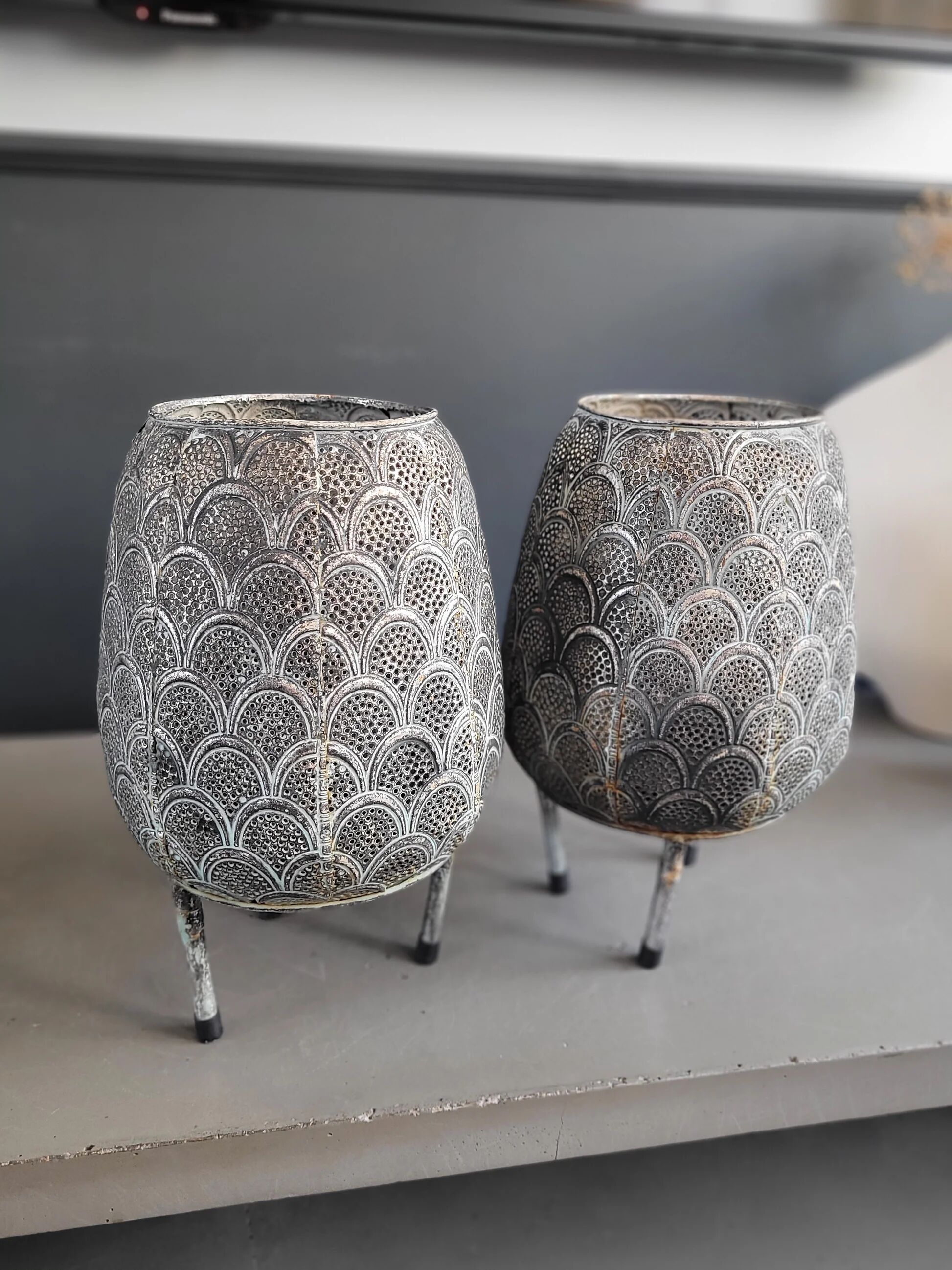 Pair of openwork metal lanterns
